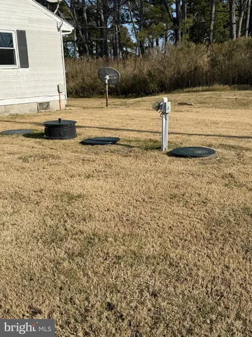 a view of a hallway with storage and utility