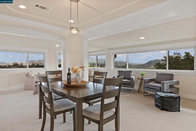 a dining room with furniture and window