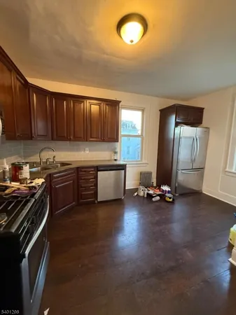 a kitchen with a sink and a stove top oven