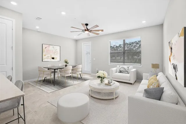 a living room with furniture and a large window