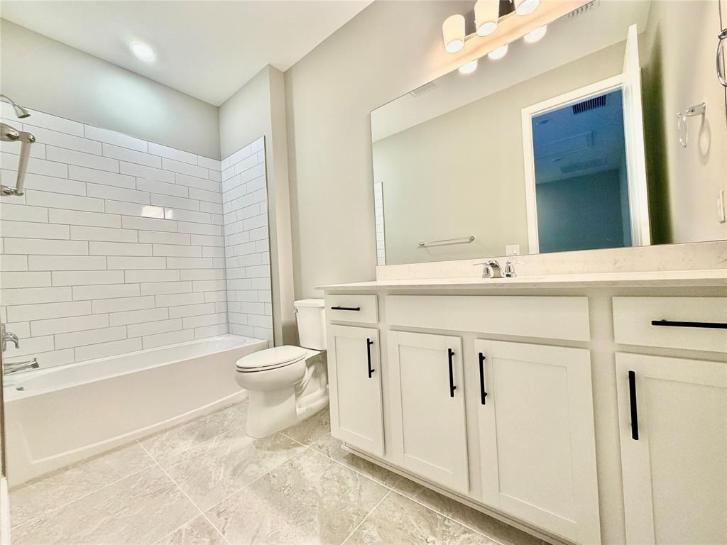 288 Southwest Sally Way Stuart, FL 34997 - Photo 11 of 22 a bathroom with a sink a toilet and shower