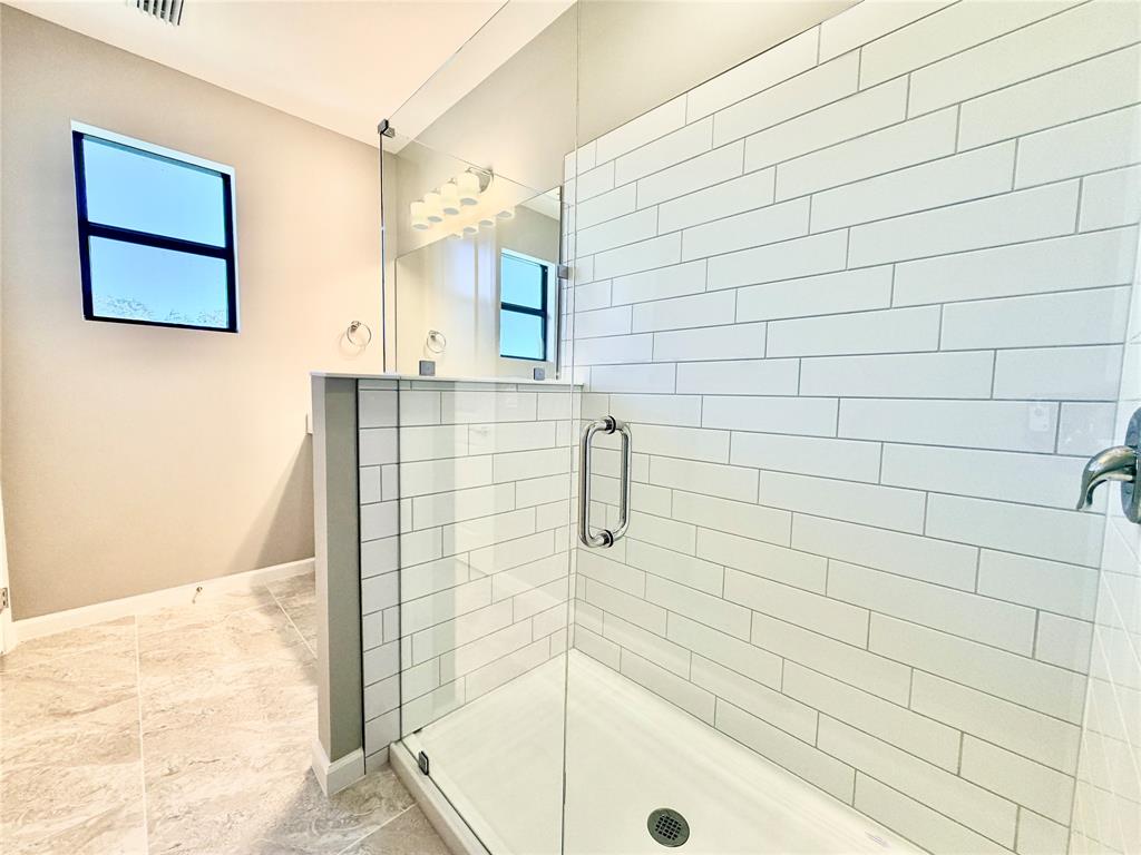 288 Southwest Sally Way Stuart, FL 34997 - Photo 17 of 22 a bathroom with a shower