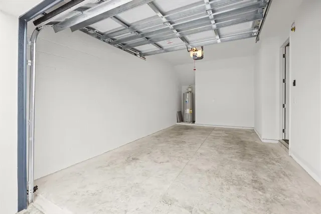 a view of a house with backyard and a garden