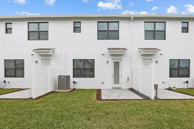 a view of a backyard with plants and a garden