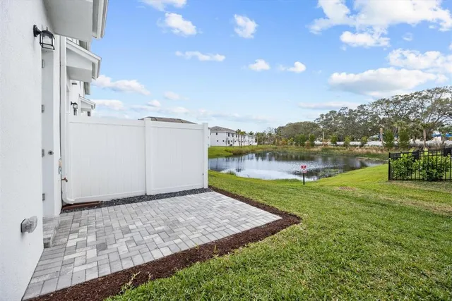 a lake view with houses in back