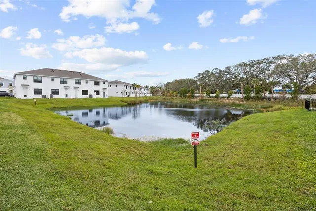 an aerial view of multiple houses with yard