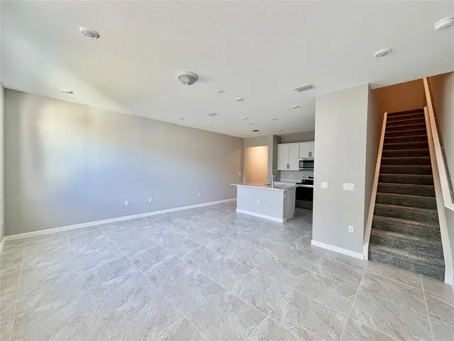 a view of kitchen and wooden floor