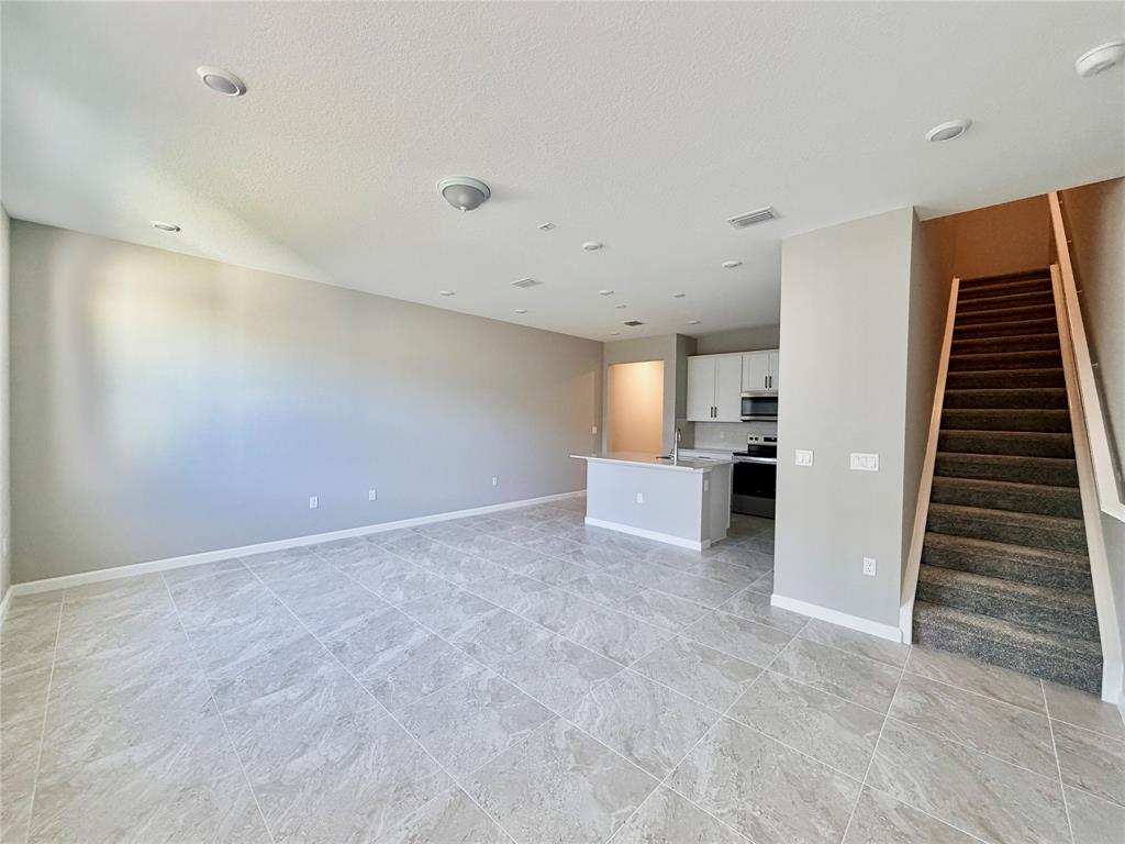 288 Southwest Sally Way Stuart, FL 34997 - Photo 6 of 22 a view of kitchen and wooden floor