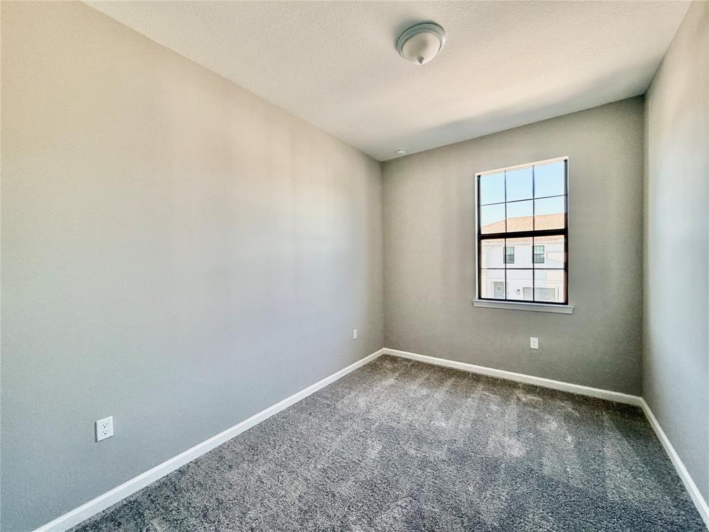 288 Southwest Sally Way Stuart, FL 34997 - Photo 9 of 22 an empty room with windows