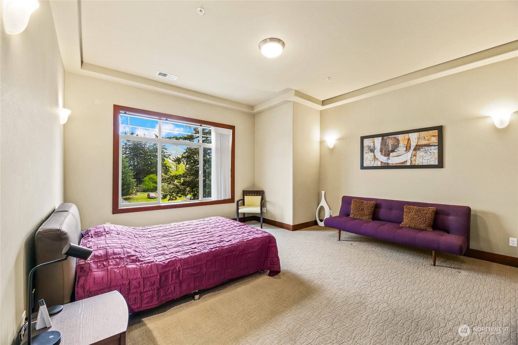 4005 Northeast 3rd Place, Unit 3E Renton, WA 98056 - Photo 11 of 28 a bed room with a bed and a couch