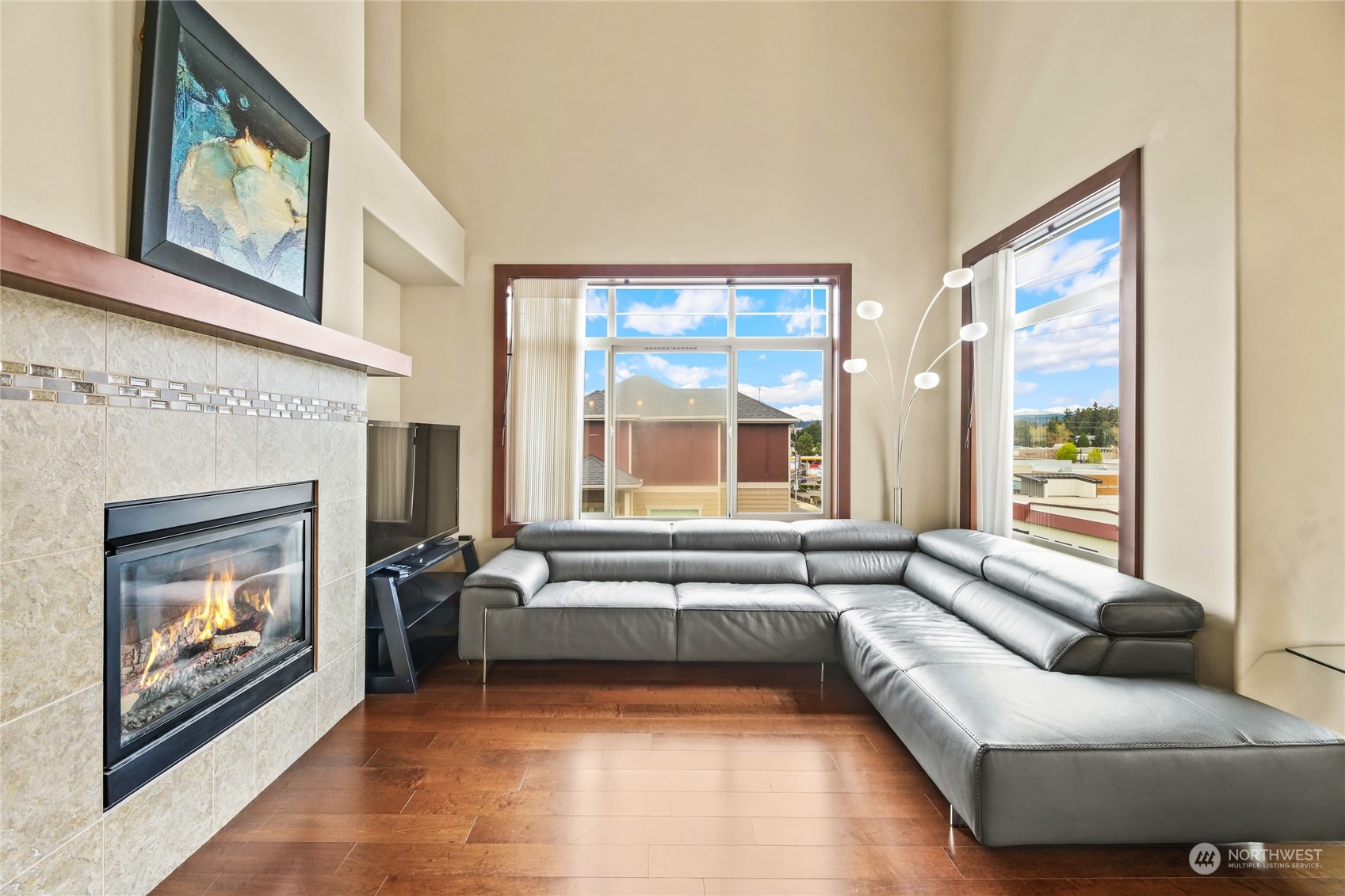 4005 Northeast 3rd Place, Unit 3E Renton, WA 98056 - Photo 6 of 28 a living room with furniture and a fireplace