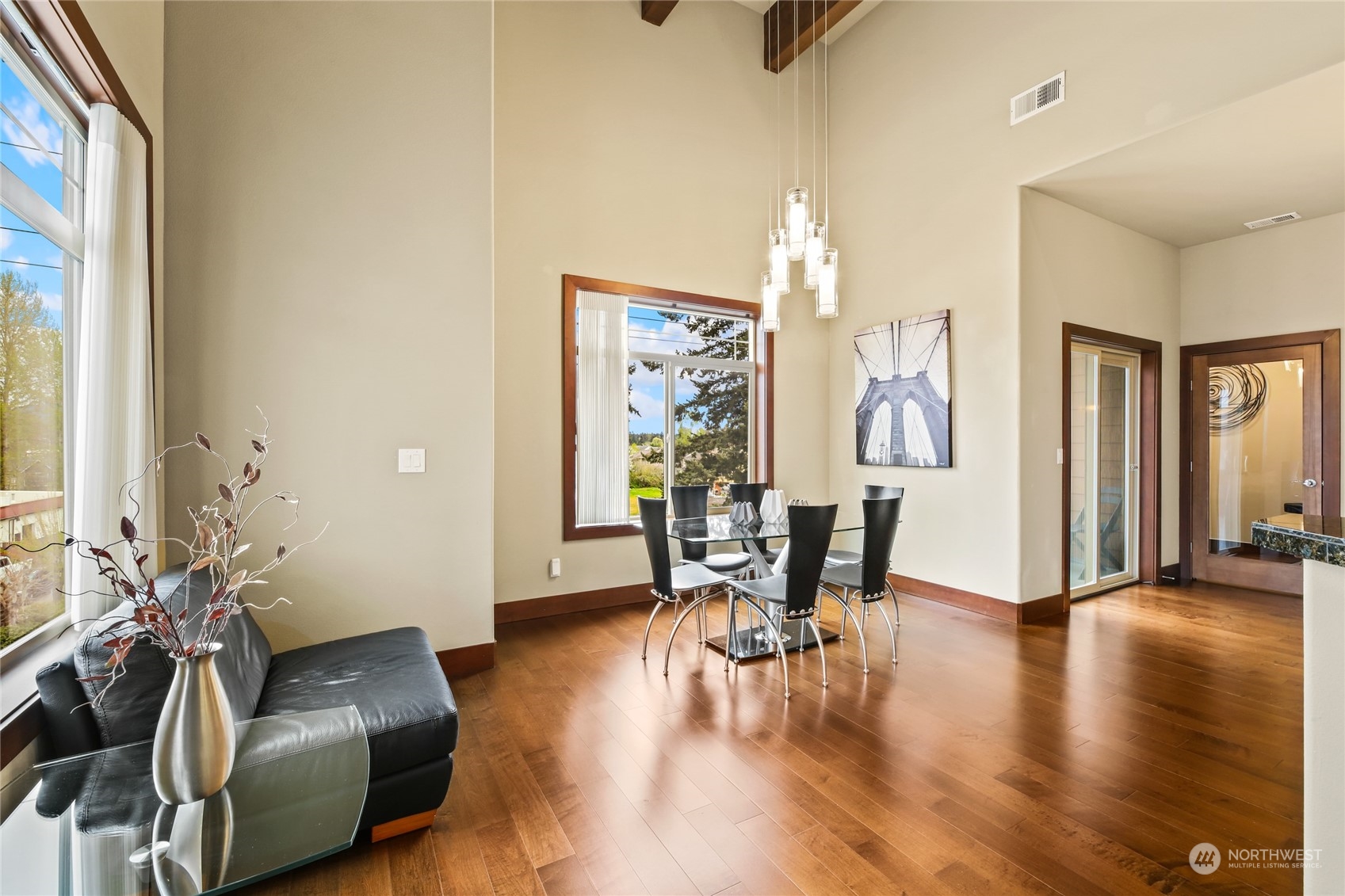 4005 Northeast 3rd Place, Unit 3E Renton, WA 98056 - Photo 7 of 28 a living room with furniture and wooden floor