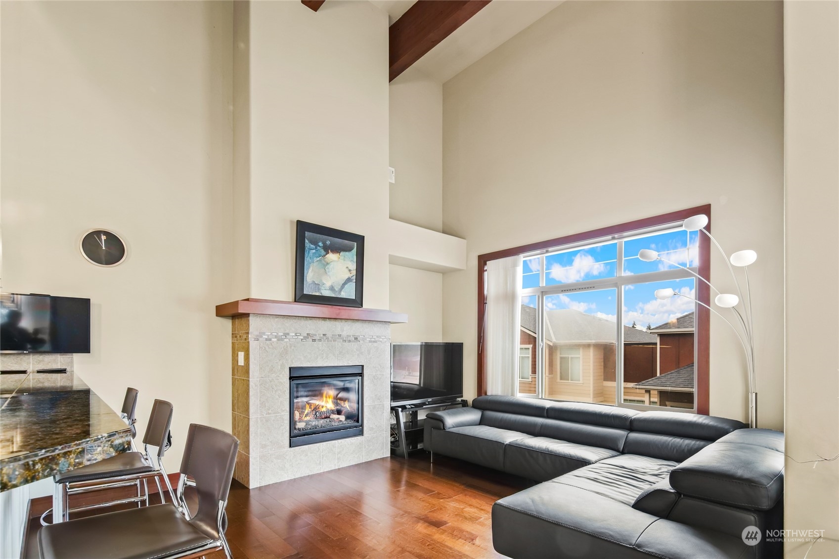 4005 Northeast 3rd Place, Unit 3E Renton, WA 98056 - Photo 8 of 28 a living room with furniture fireplace and flat screen tv
