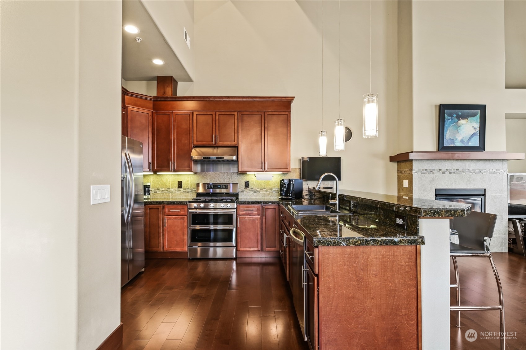 4005 Northeast 3rd Place, Unit 3E Renton, WA 98056 - Photo 9 of 28 a kitchen with a refrigerator stove and sink