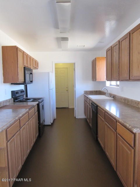 665 West Ahonen Road Paulden, AZ 86334 - Photo 5 of 18 a kitchen with sink and cabinets