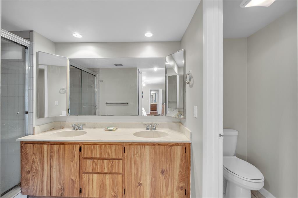 9104 Southwest 19th Place, Unit A Davie, FL 33324 - Photo 20 of 31 a bathroom with a sink a toilet a large mirror and shower