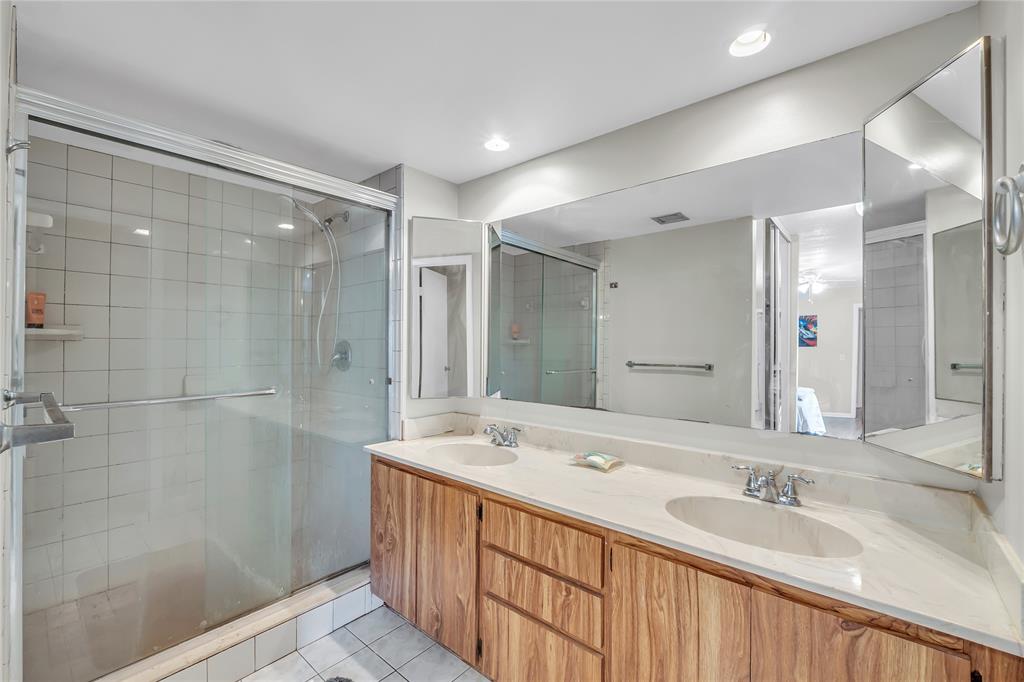 9104 Southwest 19th Place, Unit A Davie, FL 33324 - Photo 21 of 31 a bathroom with a double vanity sink mirror and shower