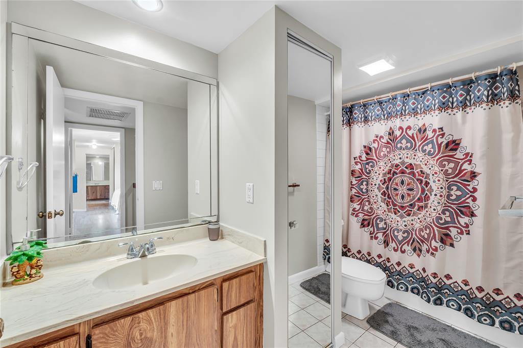 9104 Southwest 19th Place, Unit A Davie, FL 33324 - Photo 24 of 31 a bathroom with a granite countertop sink and a mirror