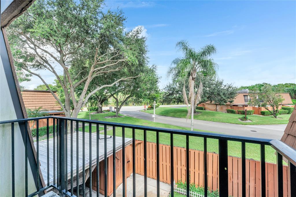 9104 Southwest 19th Place, Unit A Davie, FL 33324 - Photo 25 of 31 a balcony with street view