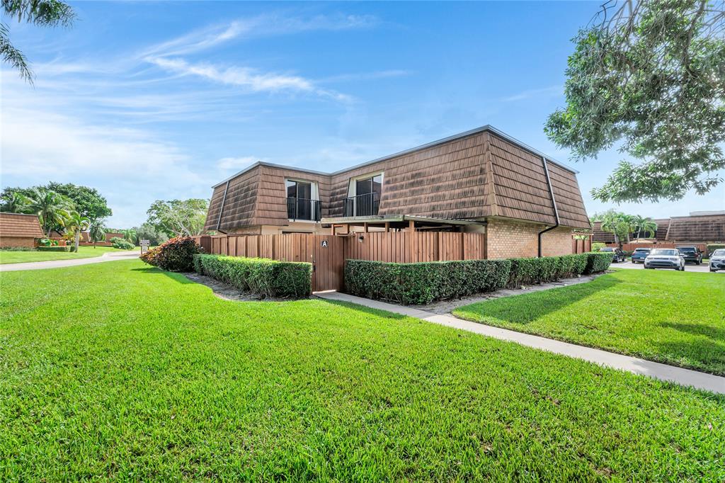 9104 Southwest 19th Place, Unit A Davie, FL 33324 - Photo 26 of 31 a backyard of a house with a garden and barbeque oven