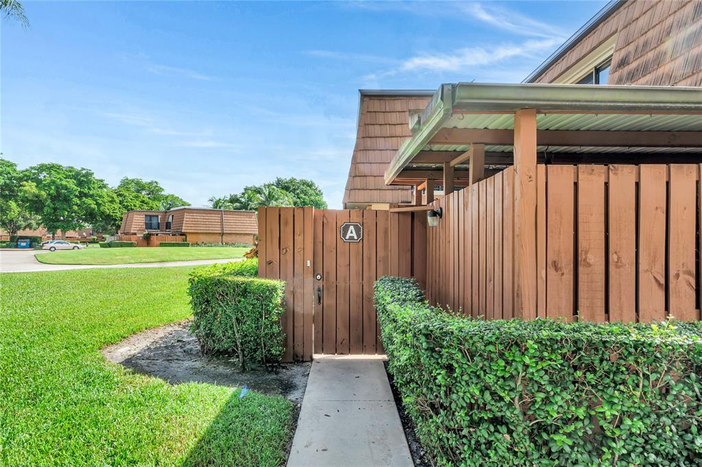 9104 Southwest 19th Place, Unit A Davie, FL 33324 - Photo 27 of 31 a view of a backyard with pathway