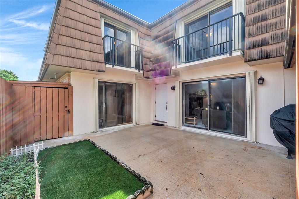 9104 Southwest 19th Place, Unit A Davie, FL 33324 - Photo 4 of 31 a view of a building with a door and a yard