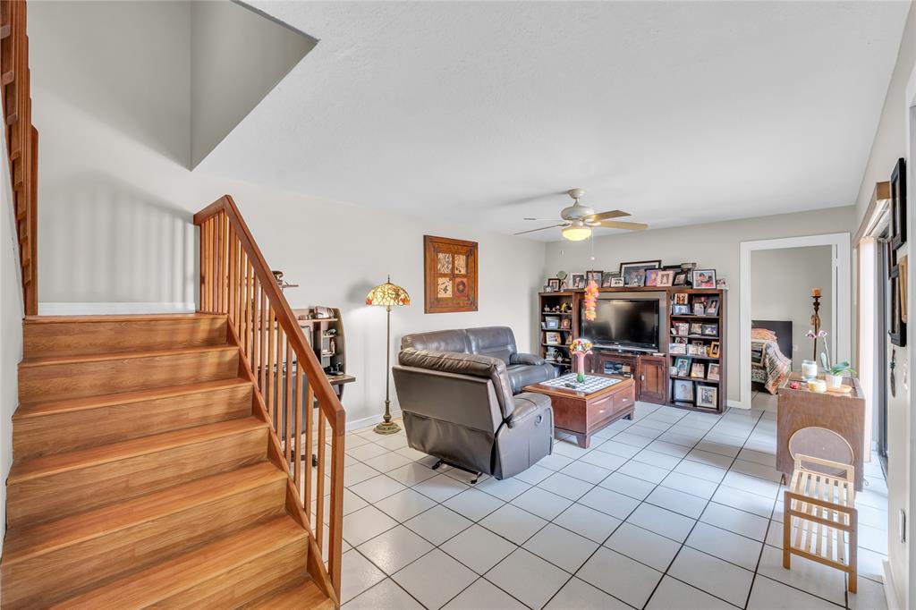 9104 Southwest 19th Place, Unit A Davie, FL 33324 - Photo 6 of 31 a living room with furniture and a fireplace