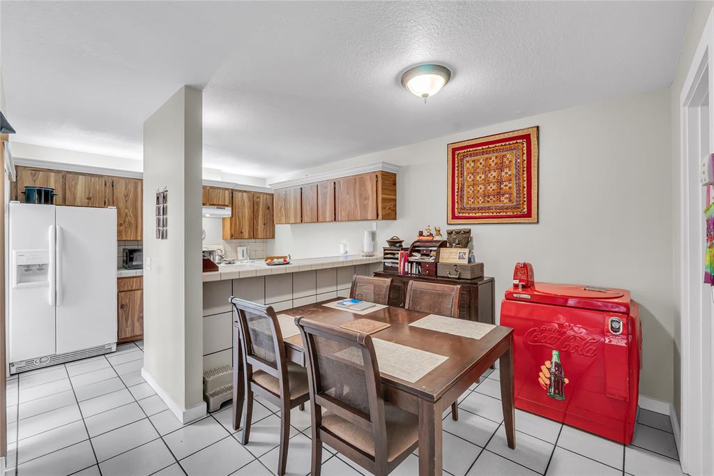 9104 Southwest 19th Place, Unit A Davie, FL 33324 - Photo 7 of 31 a view of a dining room with furniture