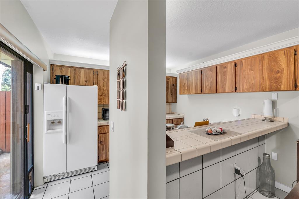 9104 Southwest 19th Place, Unit A Davie, FL 33324 - Photo 9 of 31 a kitchen with a refrigerator and a sink