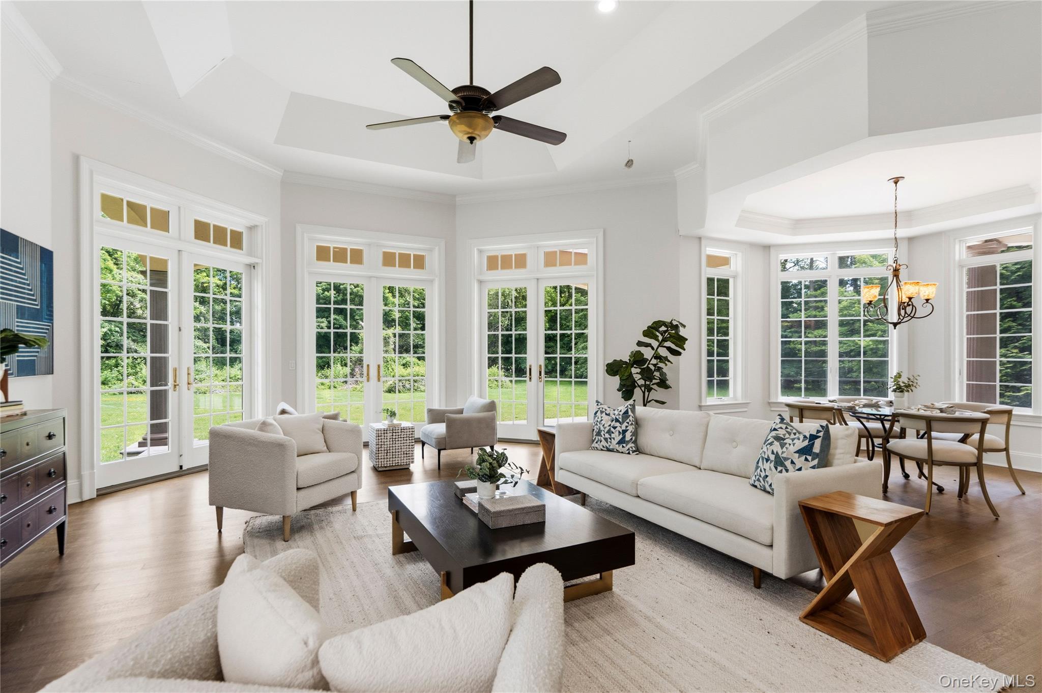 1960 Midlane Road South Syosset, NY 11791 - Photo 10 of 46 a living room with furniture and a large window with wooden floor