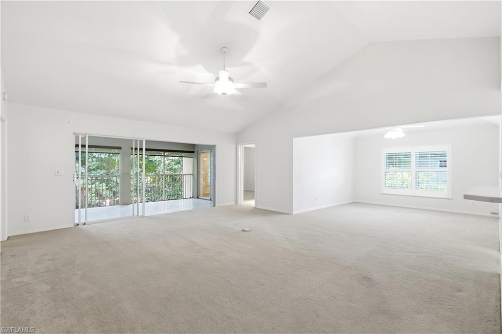 203 Via Perignon, Unit 24 Naples, FL 34119 - Photo 29 of 42 Living room/Great room leading to a private screened lanai