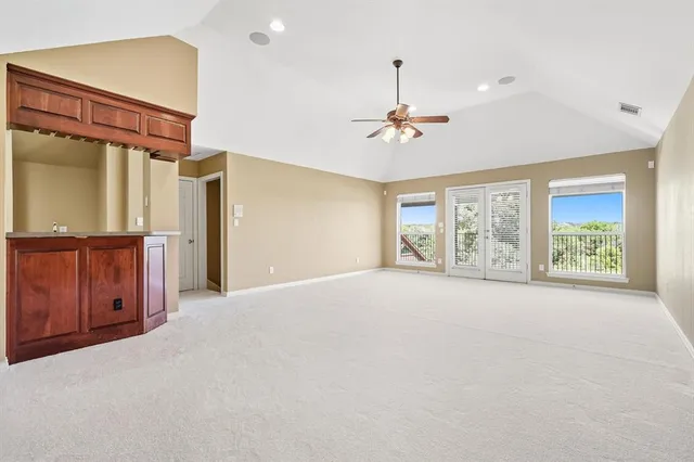 a kitchen with stainless steel appliances granite countertop a sink and cabinets