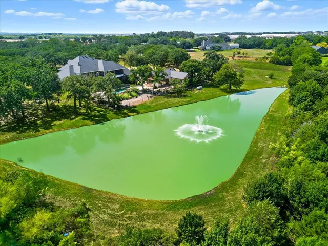 a view of a lake with houses in the back