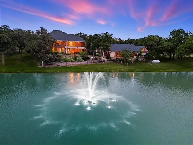 an aerial view of a house with garden space and outdoor space