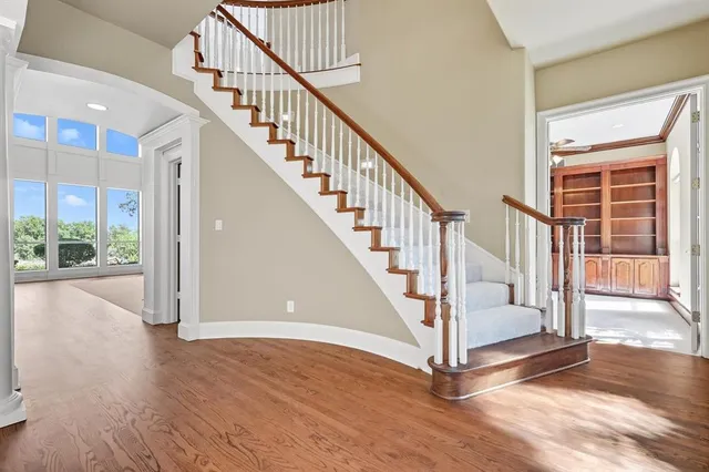 a view of staircase with white walls and windows
