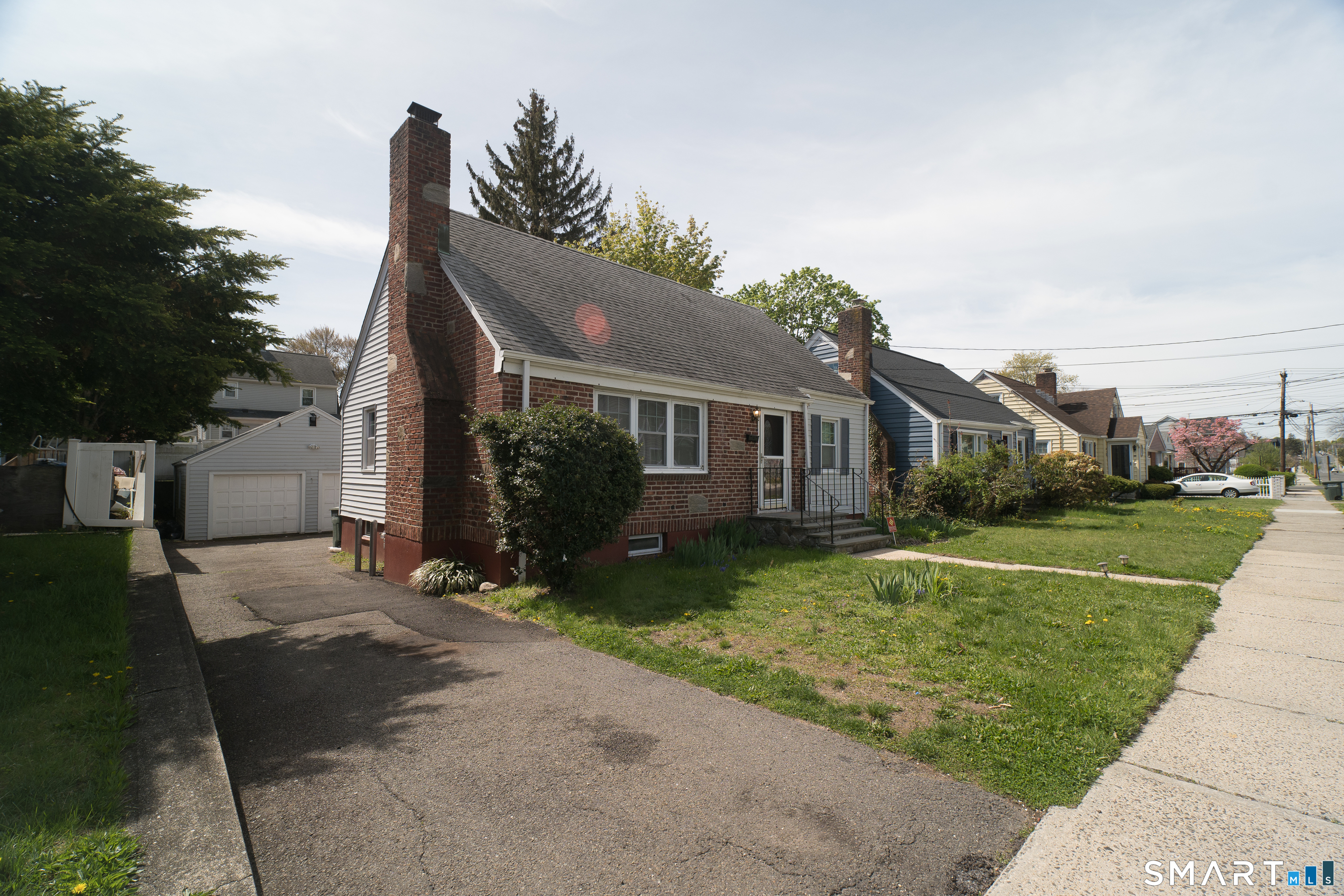 113 Clark Street Bridgeport, CT 06606 - Photo 1 of 27 a front view of a house with a yard