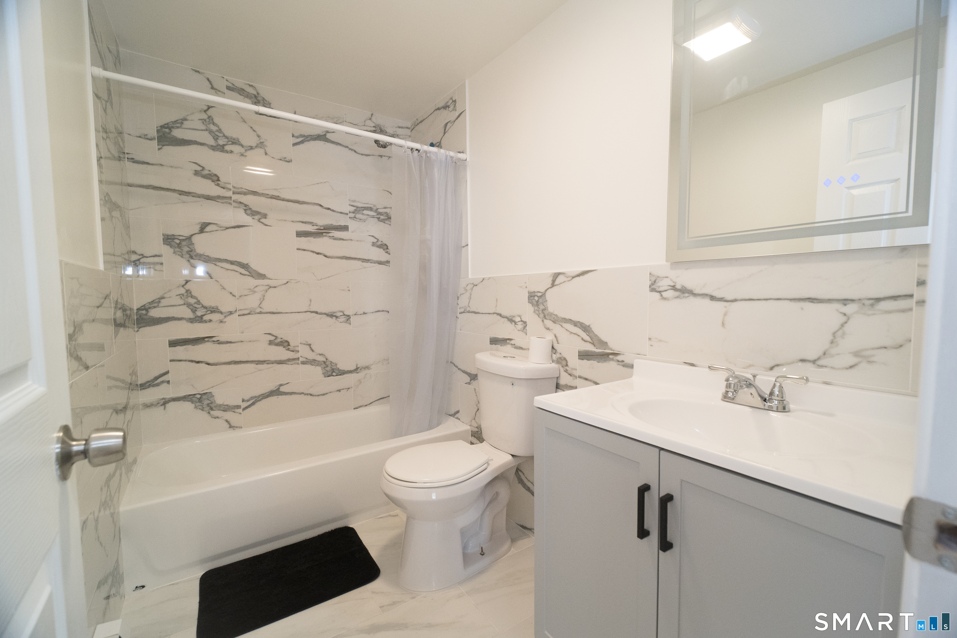 113 Clark Street Bridgeport, CT 06606 - Photo 12 of 27 a bathroom with a sink toilet and shower