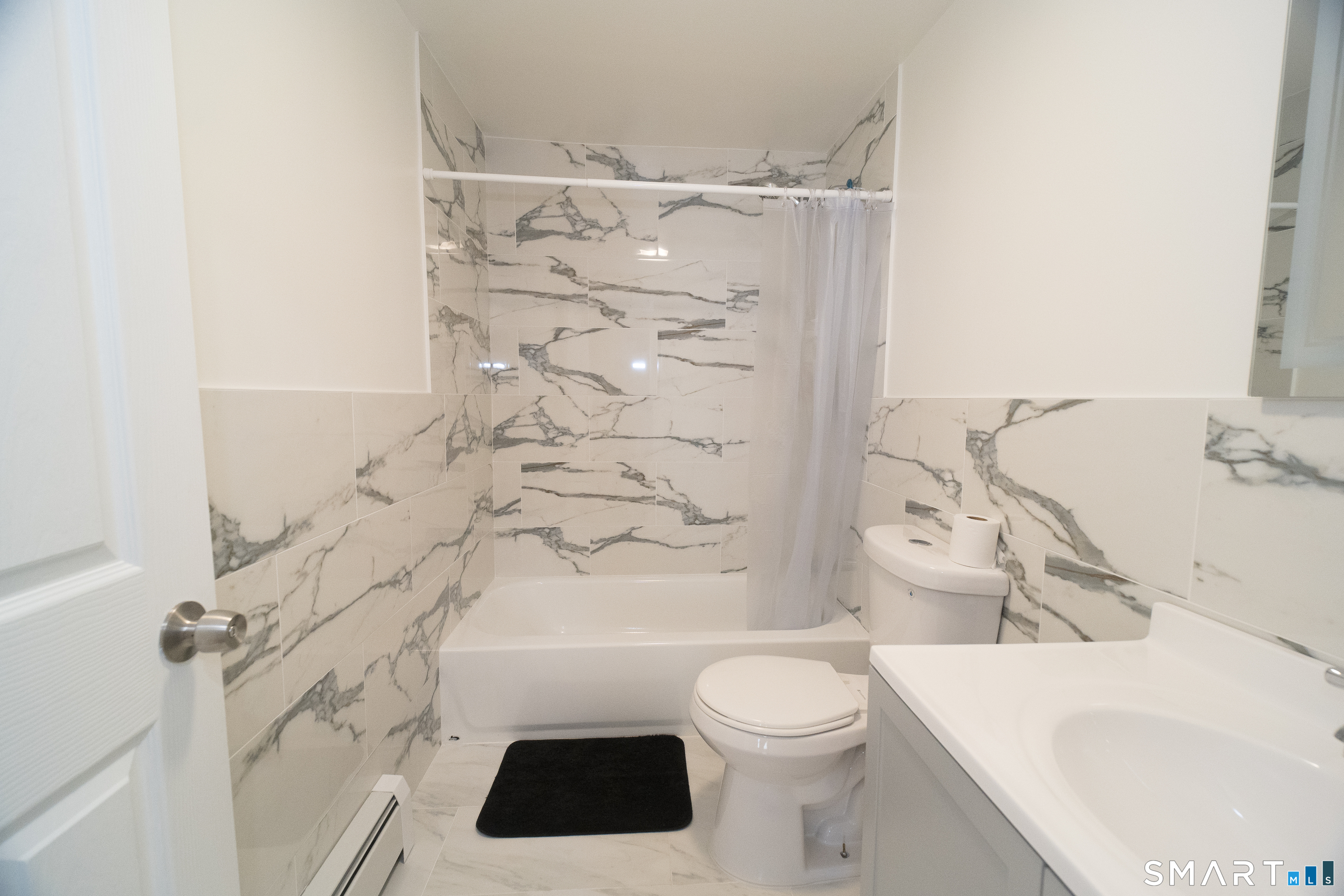 113 Clark Street Bridgeport, CT 06606 - Photo 13 of 27 a bathroom with a sink a toilet and shower