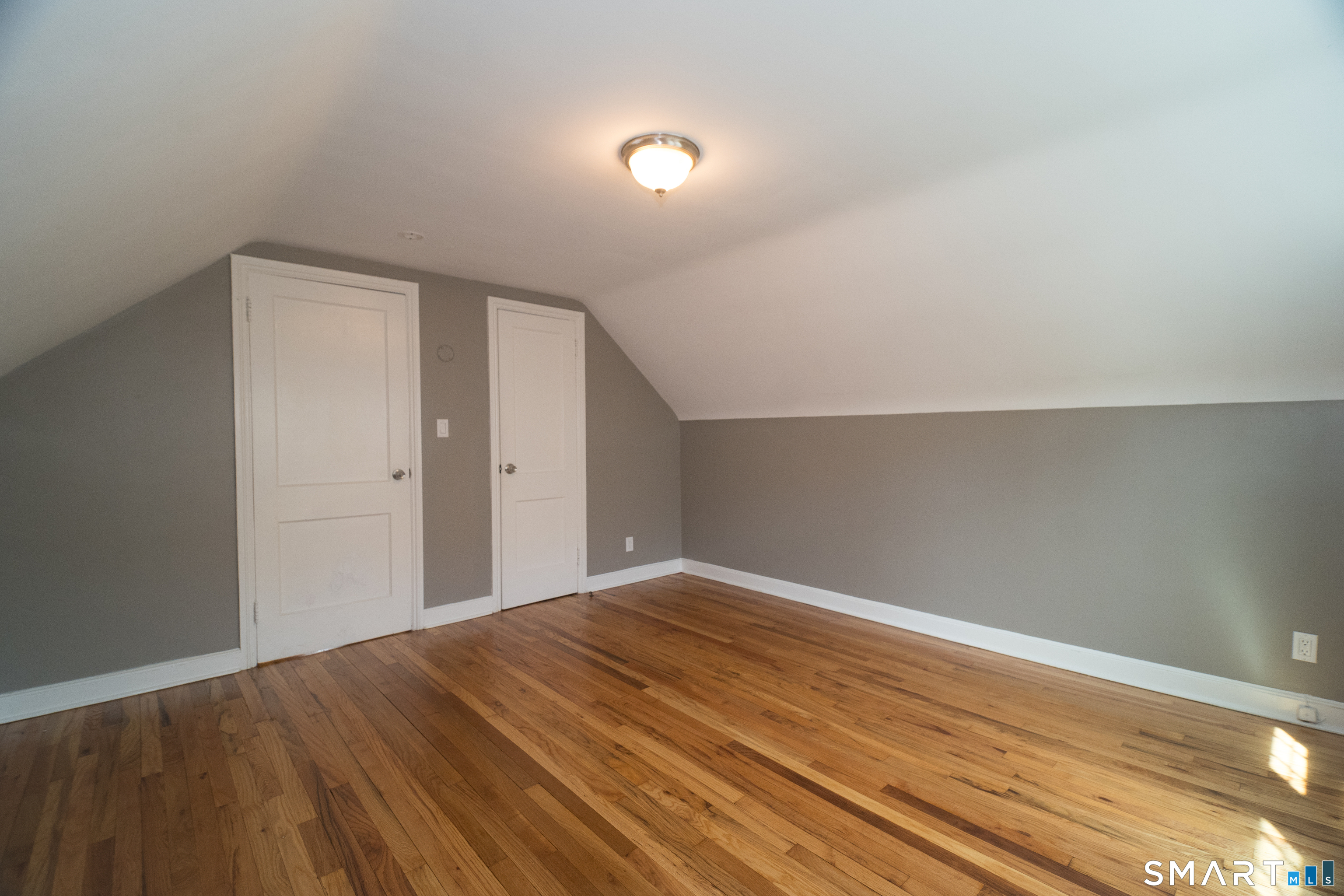 113 Clark Street Bridgeport, CT 06606 - Photo 19 of 27 a view of empty room with wooden floor