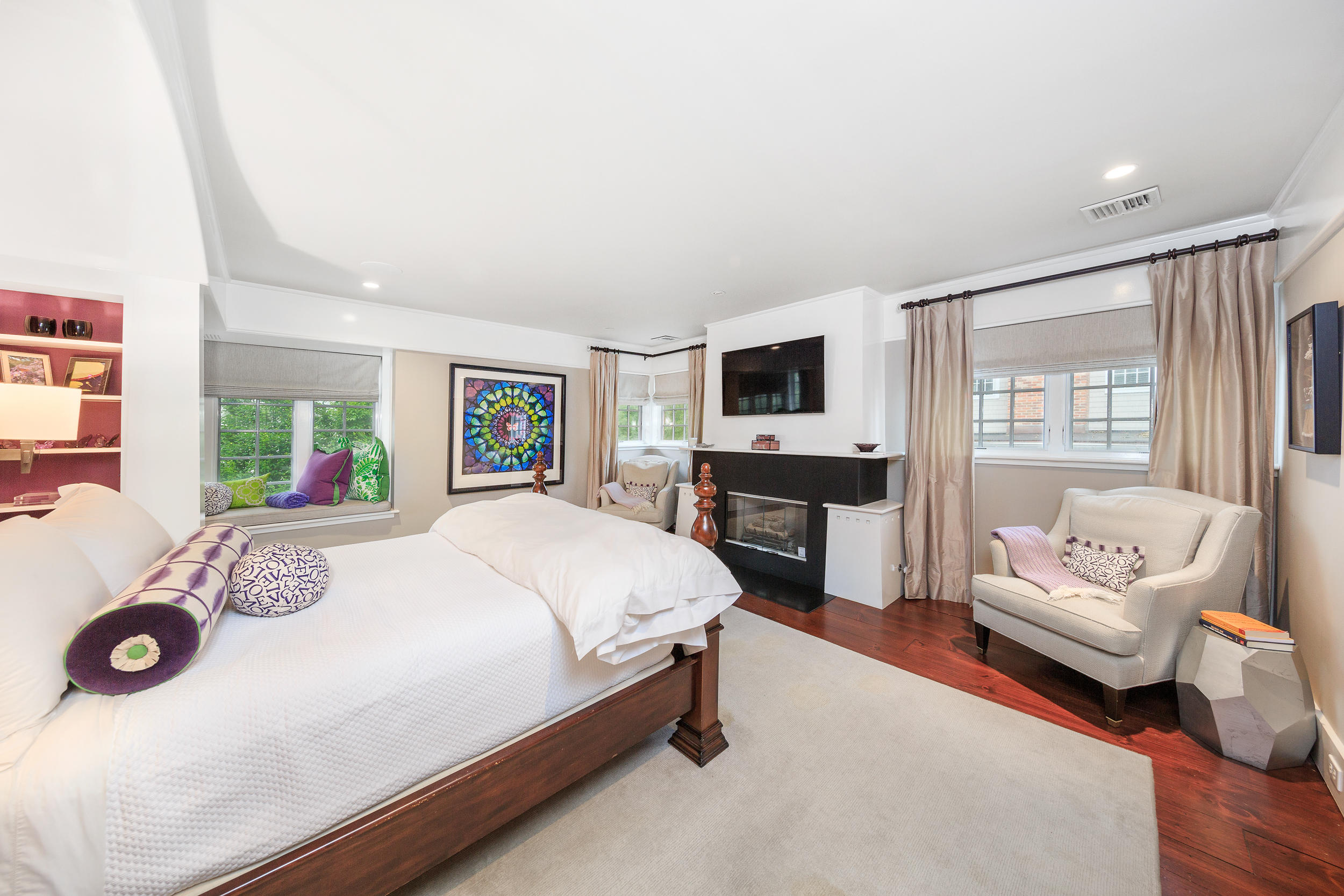 10 Juniper Road Rowayton, CT 06853 - Photo 12 of 28 a spacious bedroom with a bed a couch and a window