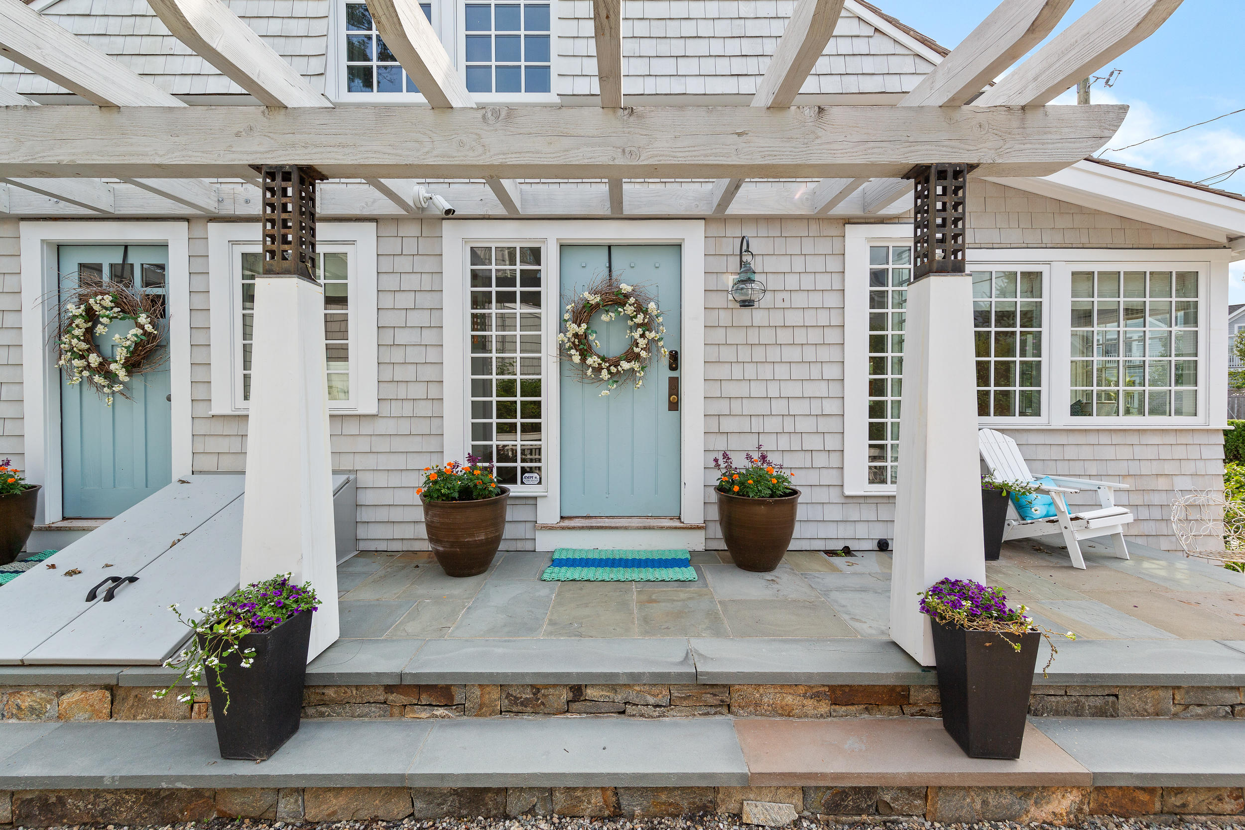 10 Juniper Road Rowayton, CT 06853 - Photo 2 of 28 a view of a patio with chairs and potted plants