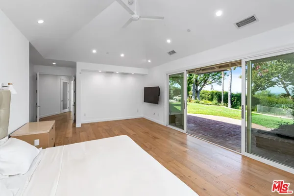 a view of kitchen with cabinets and wooden floor