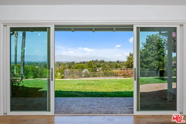 a bathroom with a shower and toilet