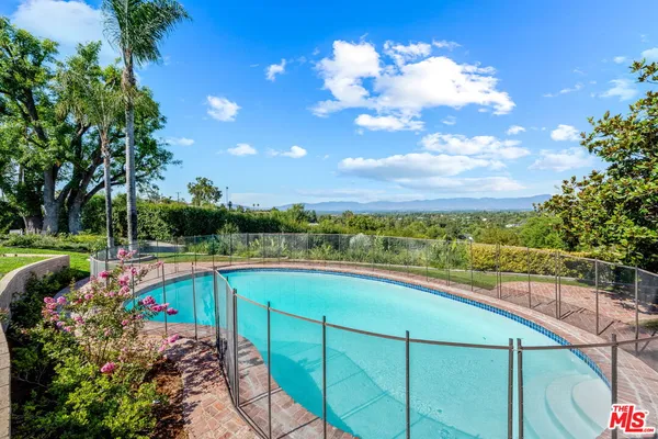 a view of a city with a tree in the background