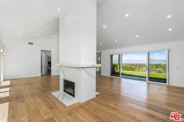a kitchen with a sink stainless steel appliances and cabinets
