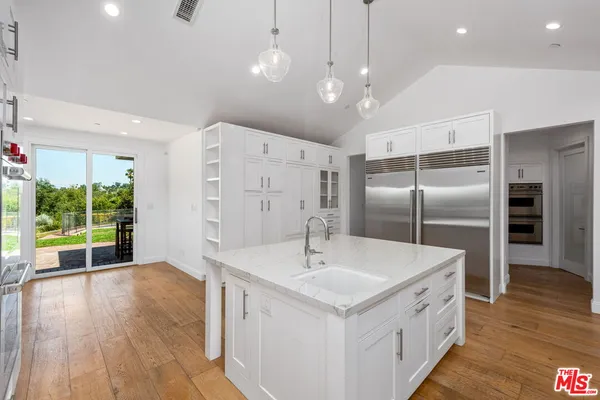 a living room with furniture and a garden