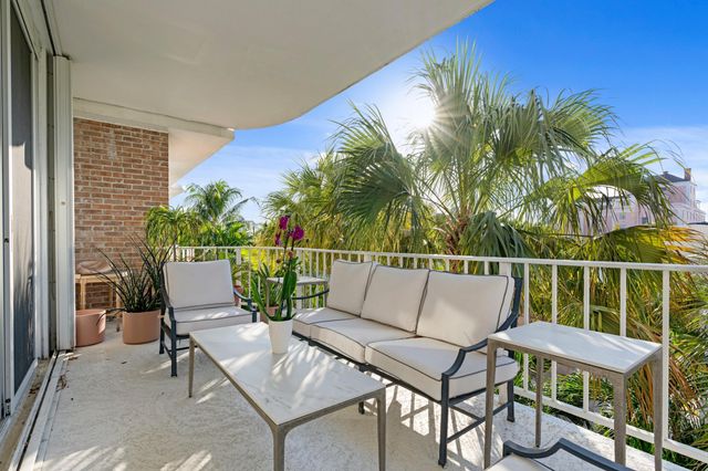 a view of a chairs and table in patio