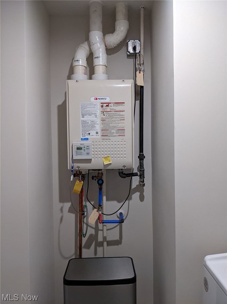174 West Spring Drive Elyria, OH 44035 - Photo 17 of 19 Utility room featuring instant water heater and washer / clothes dryer