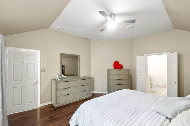 a bed room with a bed and a dresser