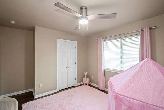 a bedroom with a bed and a couch